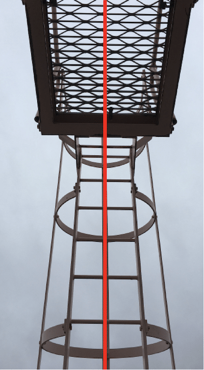 Symmetrical image of ladder with red vertical axis overlaid