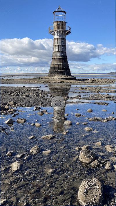 Lighthouse with rock pool in the foreground
