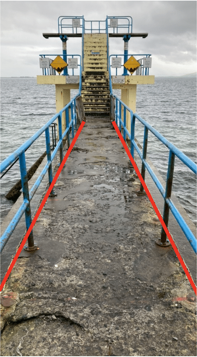 A seaside bathing platform with an overlay of red 'leading lines'
